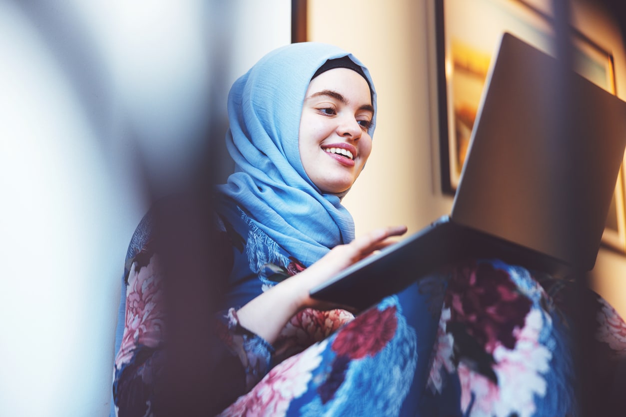 middle Eastern woman using laptop
