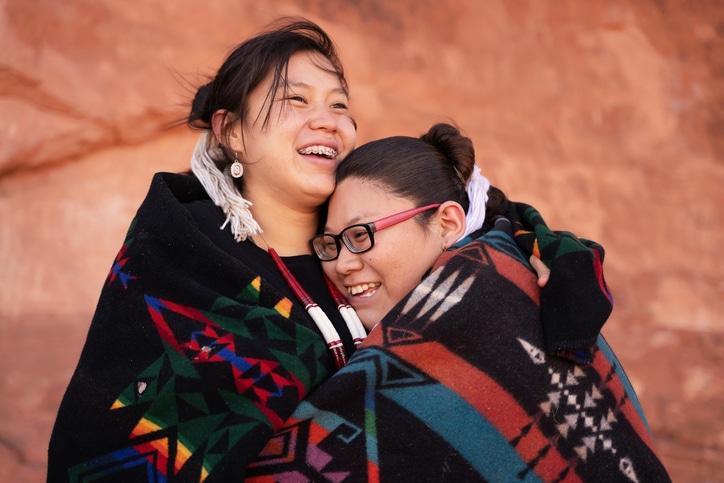 Navajo girls hugging